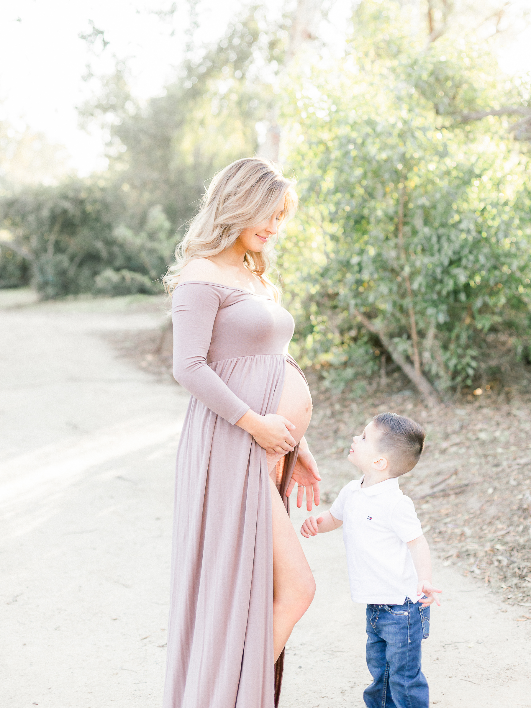 mommy and toddler posed during maternity session