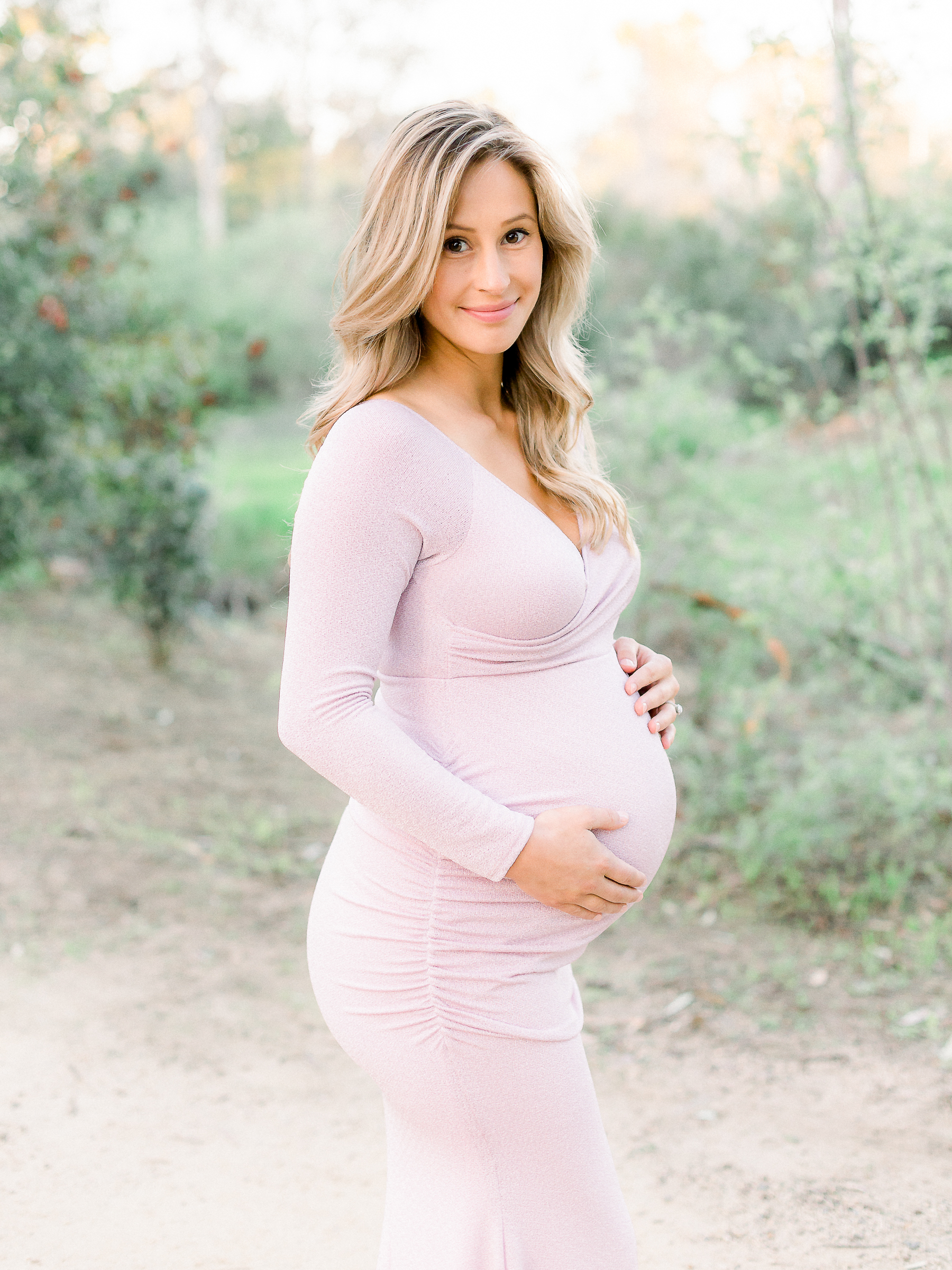 Expecting mom smiling during her maternity photo session
