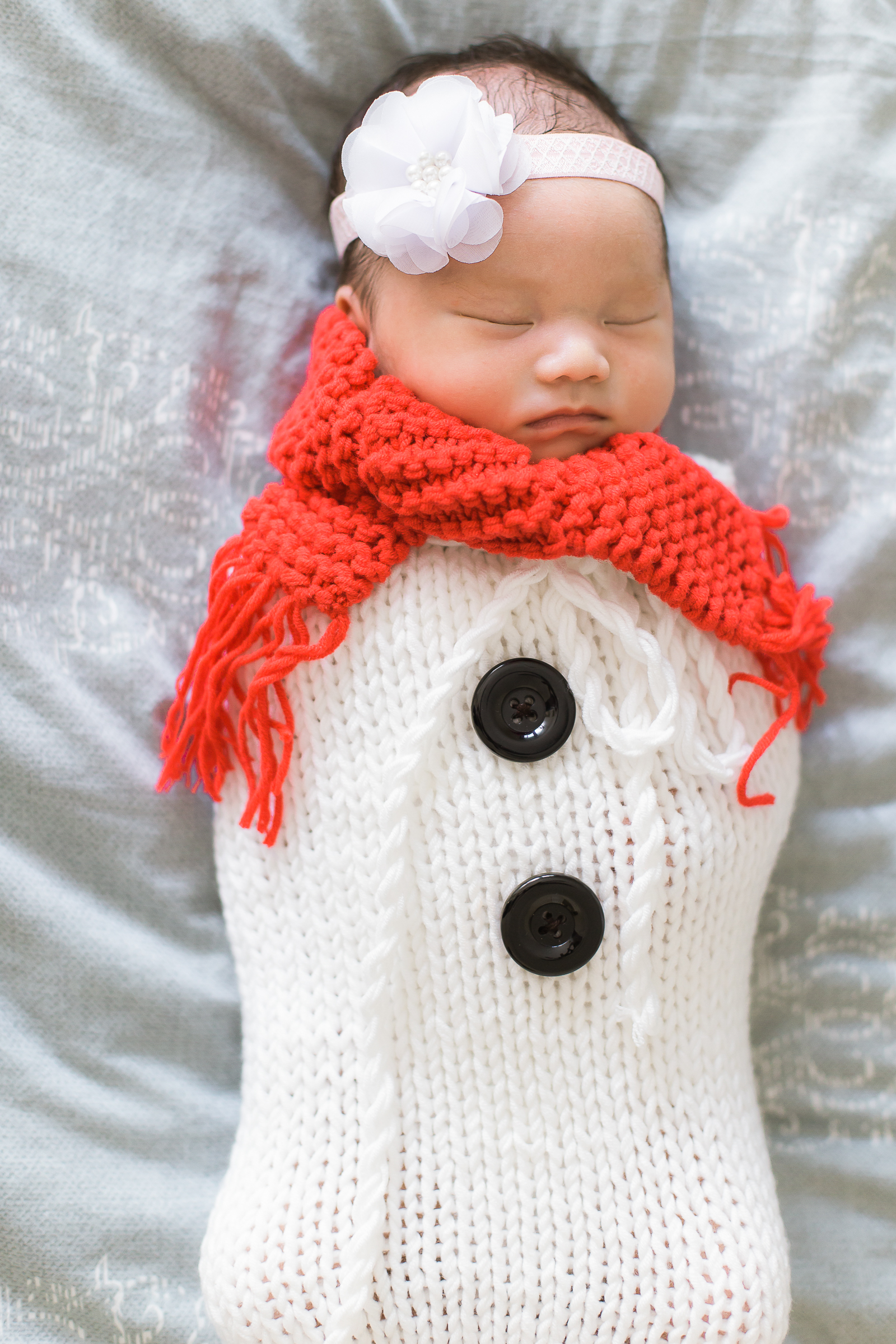 Baby sleeping in Christmas outfit