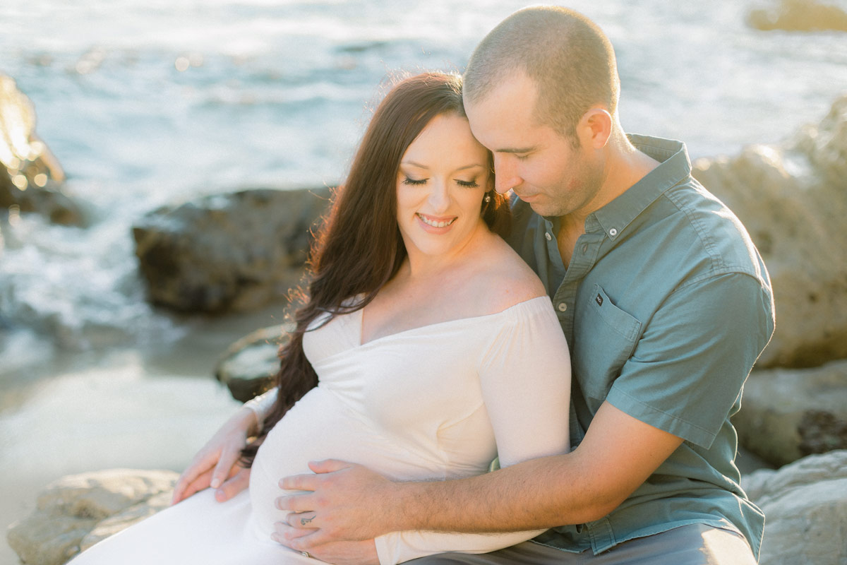 couple expecting baby photographed at Corona del Mar
