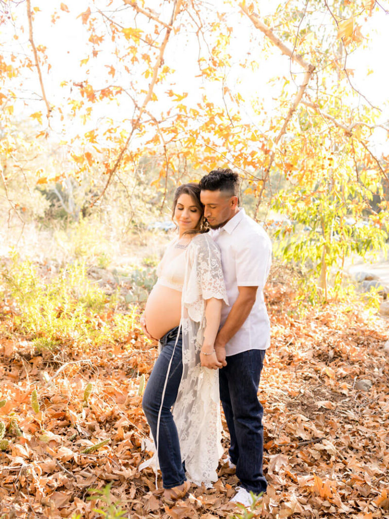Expecting couple posing for maternity photos
